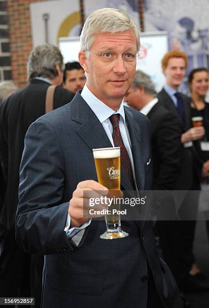 Prince Philippe of Belgium drinks a Crown Lager beer at Carlton BrewHouse on November 26, 2012 in Melbourne, Australia. Prince Philippe is on a...