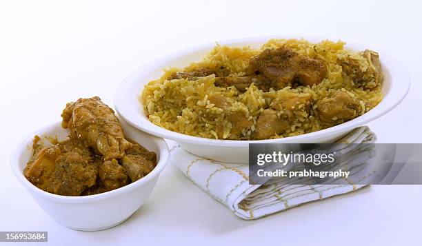 chicken biriyani and chicken gravy - biriyani stockfoto's en -beelden