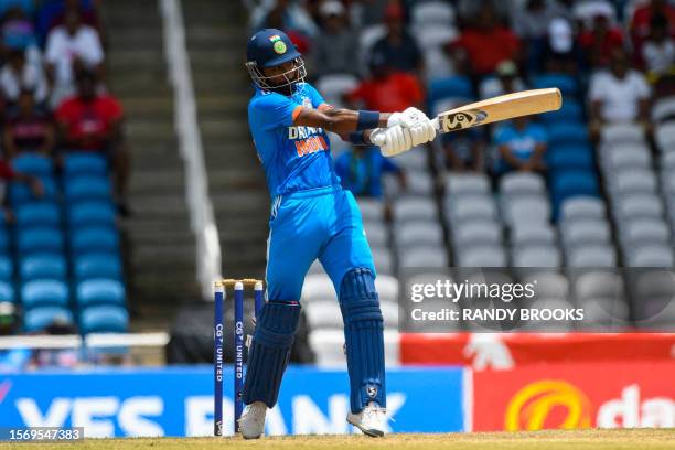 Hardik Pandya of India hits 4 during the third One Day International cricket match between West Indies and India, at Brian Lara Stadium in Tarouba,...