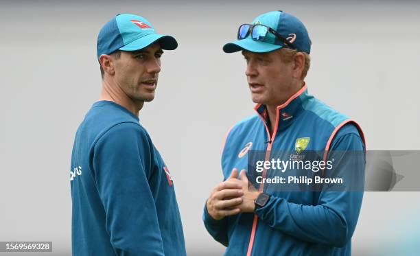 Pat Cummins and Andrew McDonald of Australia talk during a training session before the 5th Test between England and Australia at The Kia Oval on July...