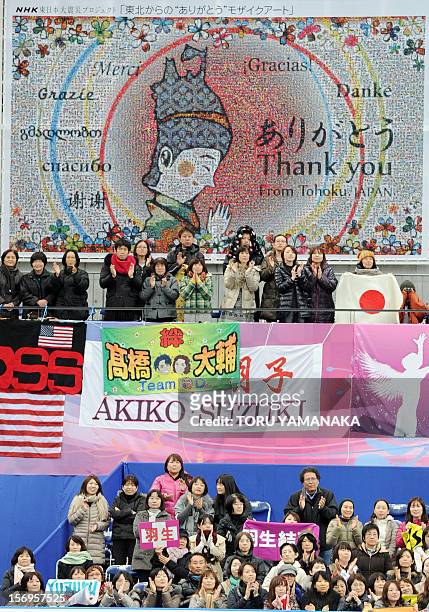 Japan-disaster-FSkate-Prix-JPN,FOCUS by Shigemi Sato In a picture taken on November 25 spectators applaud under a mosaic art piece expressing...