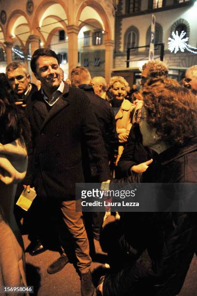 Mayor of Florence Matteo Renzi greets an old lady while lining up to vote in the 2012 PD Primary Elections on November 25, 2012 in Florence, Italy....