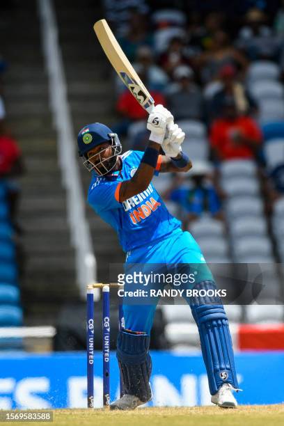 Hardik Pandya of India hits 6 during the third One Day International cricket match between West Indies and India, at Brian Lara Stadium in Tarouba,...