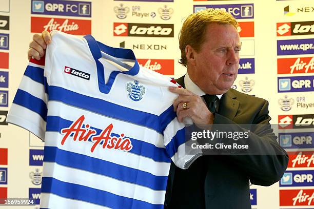 Harry Redknapp poses with the team shirt after being unveiled as the new Queens Park Rangers Manager on November 26, 2012 in Harlington, England.