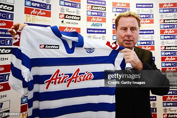 Harry Redknapp poses with the team shirt after being unveiled as the new Queens Park Rangers Manager on November 26, 2012 in Harlington, England.