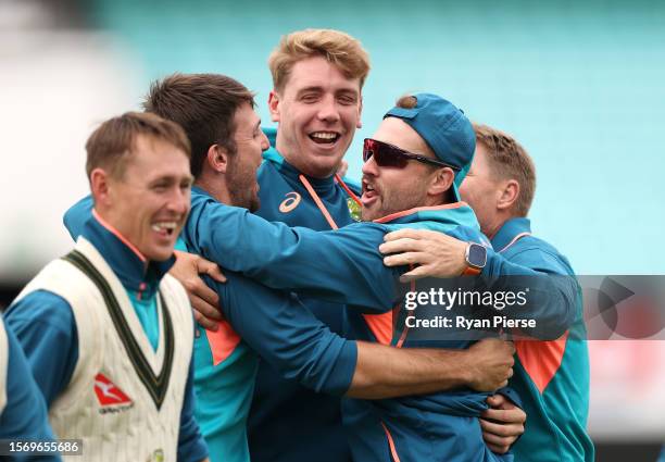 Mitch Marsh, Cameron Green and Josh Inglis of Australia react while warming up during the Australia Nets Session at The Kia Oval on July 25, 2023 in...