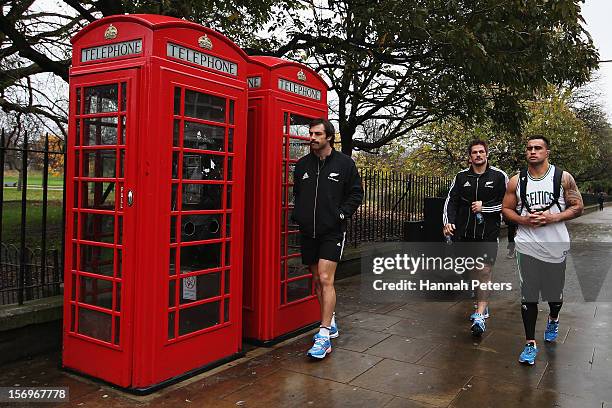 Conrad Smith, Richie McCaw and Liam Messam of the All Blacks return from a recovery session at the Imperial College on November 26, 2012 in London,...