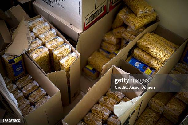 Boxes with pasta stand inside a Red Cross post ready to be handed out on November 23, 2012 in Villacanas, Spain. During the boom years, where in its...