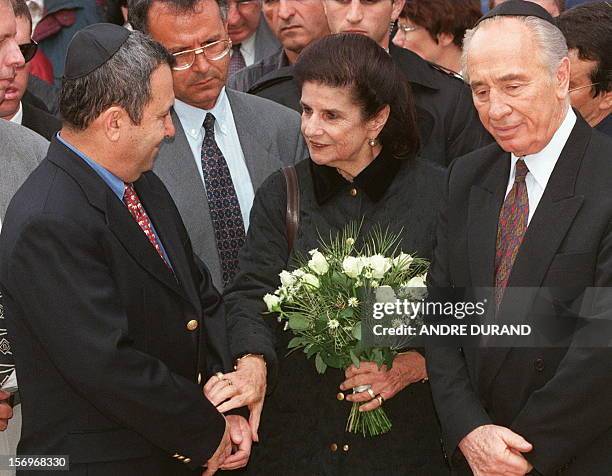 Leah Rabin , the wife of late Israeli Premier Yitzhak Rabin, talks to former Israeli Labor party leader Shimon Peres and his successor Ehud Barak...