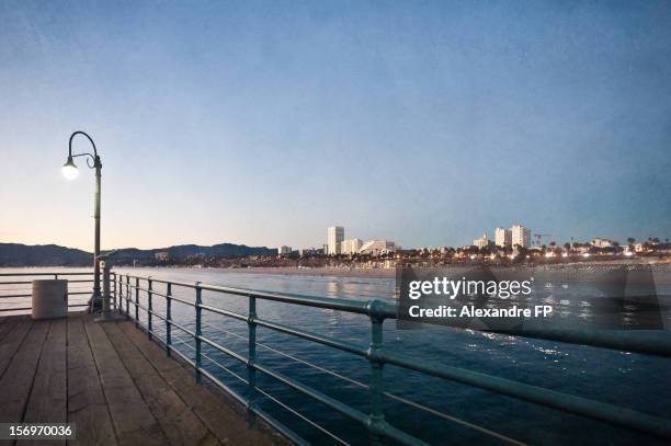 santa monica skyline at dusk from the pier - santa monica skyline stock pictures, royalty-free photos & images