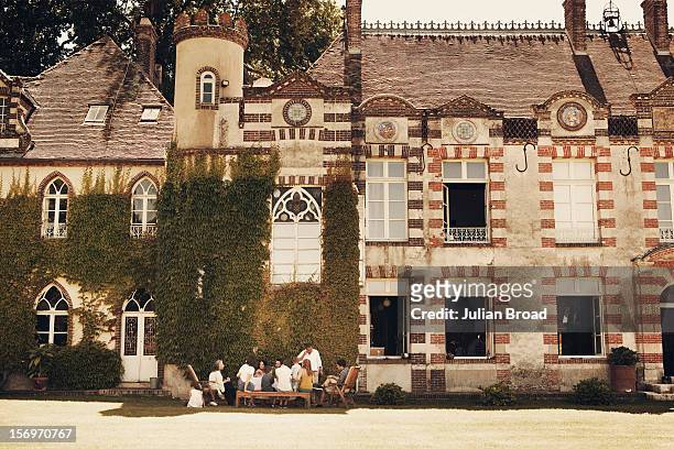 Designer and founder of A.P.C Jean Touitou is photographed at his chateau in Breuil-Benoit with family for Bon Appetit magazine on June 26, 2011 near...