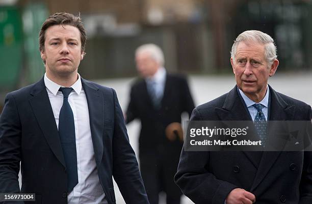 Prince Charles, Prince of Wales arrives with Jamie Oliver at Carshalton Boys Sports college to see how the school has transformed its approach to...