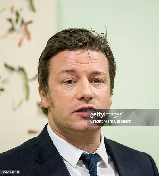 Jamie Oliver makes a speech during a visit to Carshalton Boys Sports college withÊPrince Charles, Prince of Wales to see how the school has...