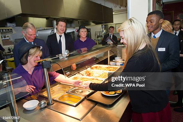 Prince Charles, Prince of Wales visits Carshalton Boys Sports College with Jamie Oliver to see how the school has transformed its approach to healthy...