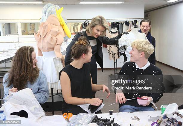 Princess Mathilde of Belgium talks to students during a visit at the ENSAV Arts Academy on November 26, 2012 in Brussels, Belgium.