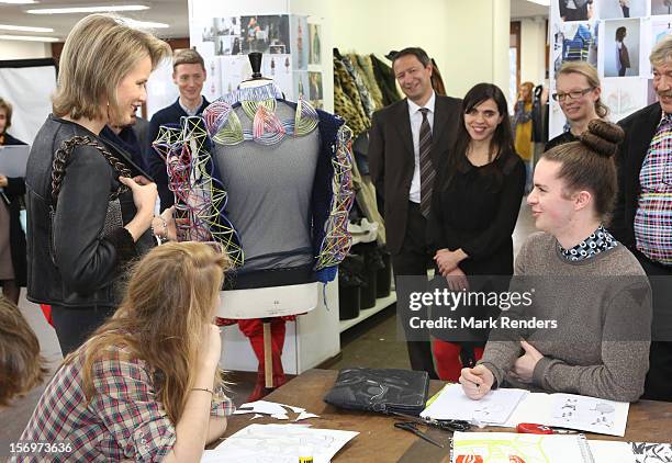 Princess Mathilde of Belgium talks to students during a visit at the ENSAV Arts Academy on November 26, 2012 in Brussels, Belgium.