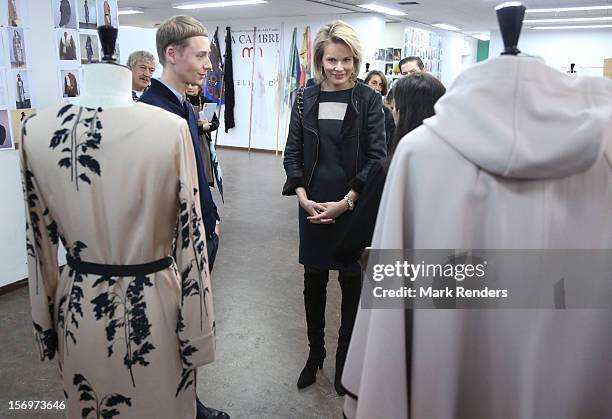 Princess Mathilde of Belgium talks to a student during a visit at the ENSAV Arts Academy on November 26, 2012 in Brussels, Belgium.