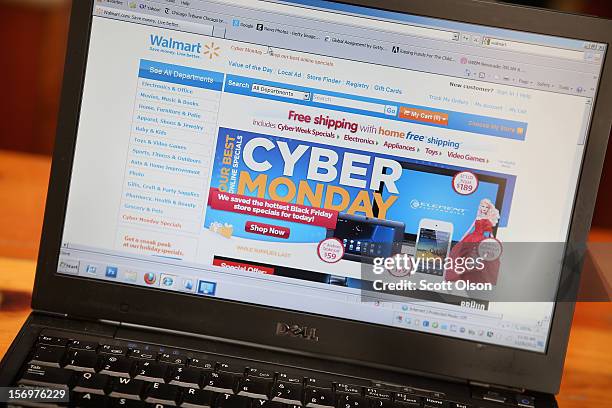 In this photo illustration, Walmart advertises Cyber Monday sales on the company's website on November 26, 2012 in Chicago, Illinois. Americans are...