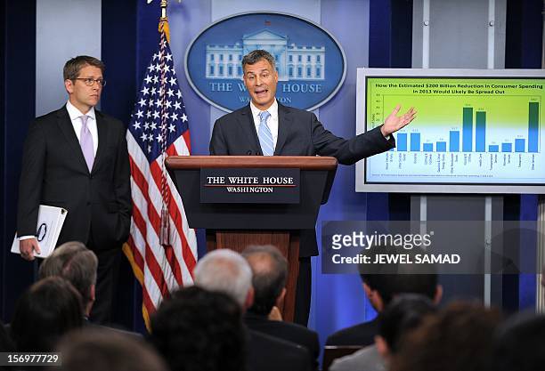 The Chairman of US President Barack Obama’s Council of Economic Advisers Alan Krueger speaks as White House Press Secretary Jay Carney looks on...