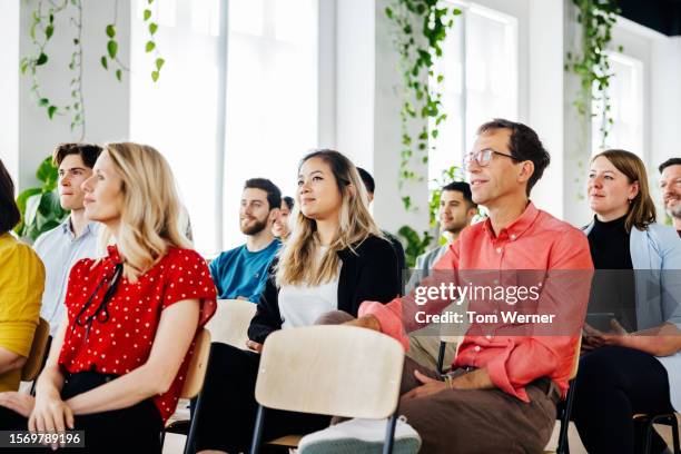 group of colleagues listening during presentation - part of the day stock pictures, royalty-free photos & images