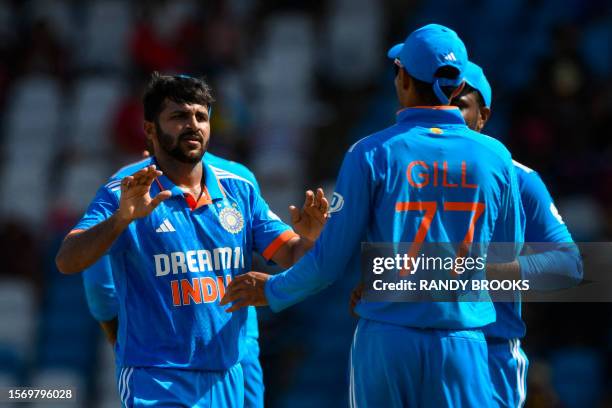 Shardul Thakur , of India, celebrates the dismissal of Romario Shepherd, of West Indies, during the third One Day International cricket match between...