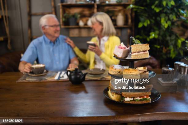 afternoon tea at a cafe - cakestand stock pictures, royalty-free photos & images