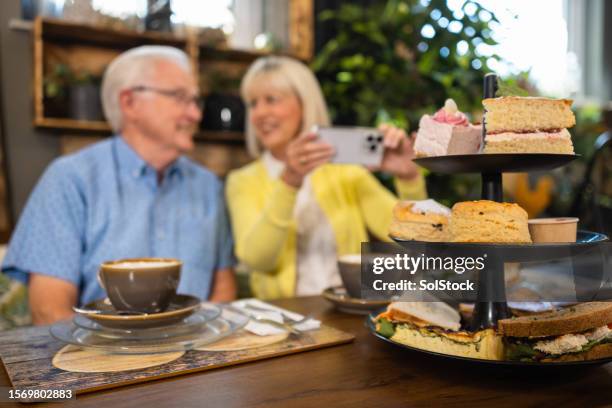 afternoon tea at a small business - english afternoon tea stock pictures, royalty-free photos & images