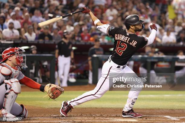 Lourdes Gurriel Jr. #12 of the Arizona Diamondbacks bats against the St. Louis Cardinals during the MLB game at Chase Field on July 24, 2023 in...