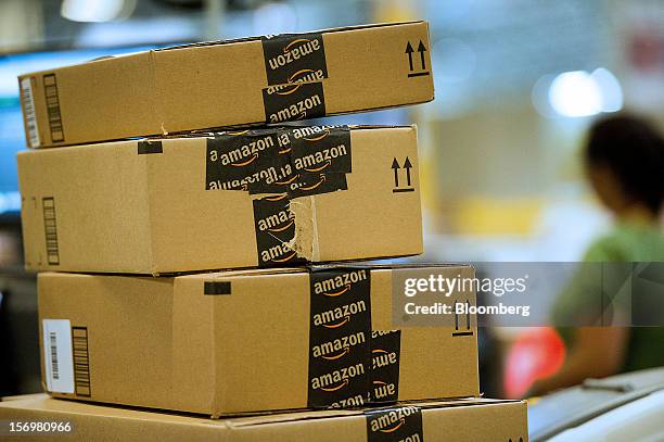 Boxes filled with merchandise sit stacked before shipment at the Amazon.com Inc. Distribution center in Phoenix, Arizona, U.S. On Monday, Nov. 26,...