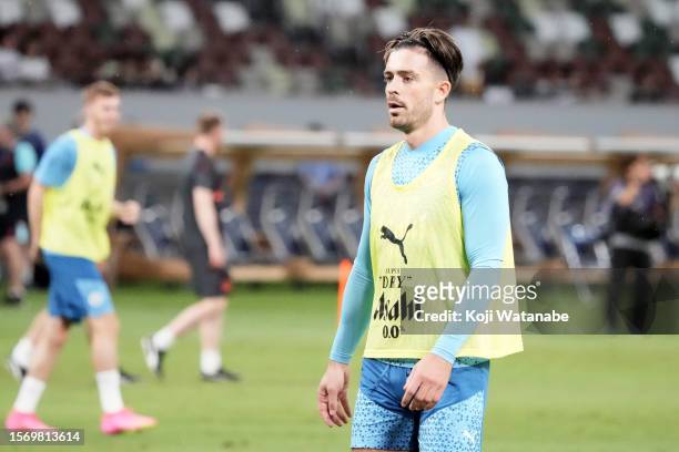 Jack Grealish of Manchester City looks on during the Manchester City press conference & training session at National Stadium on July 25, 2023 in...