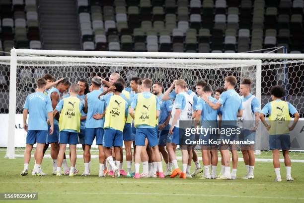Manchester City team players in action during the Manchester City press conference & training session at National Stadium on July 25, 2023 in Tokyo,...