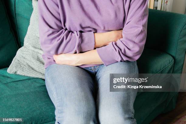 stomachache - woman stock pictures, royalty-free photos & images