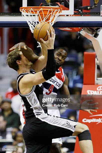 Martell Webster of the Washington Wizards fouls Tiago Splitter of the San Antonio Spurs during the first half at Verizon Center on November 26, 2012...