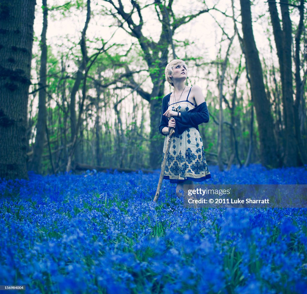 Girl in blue forest