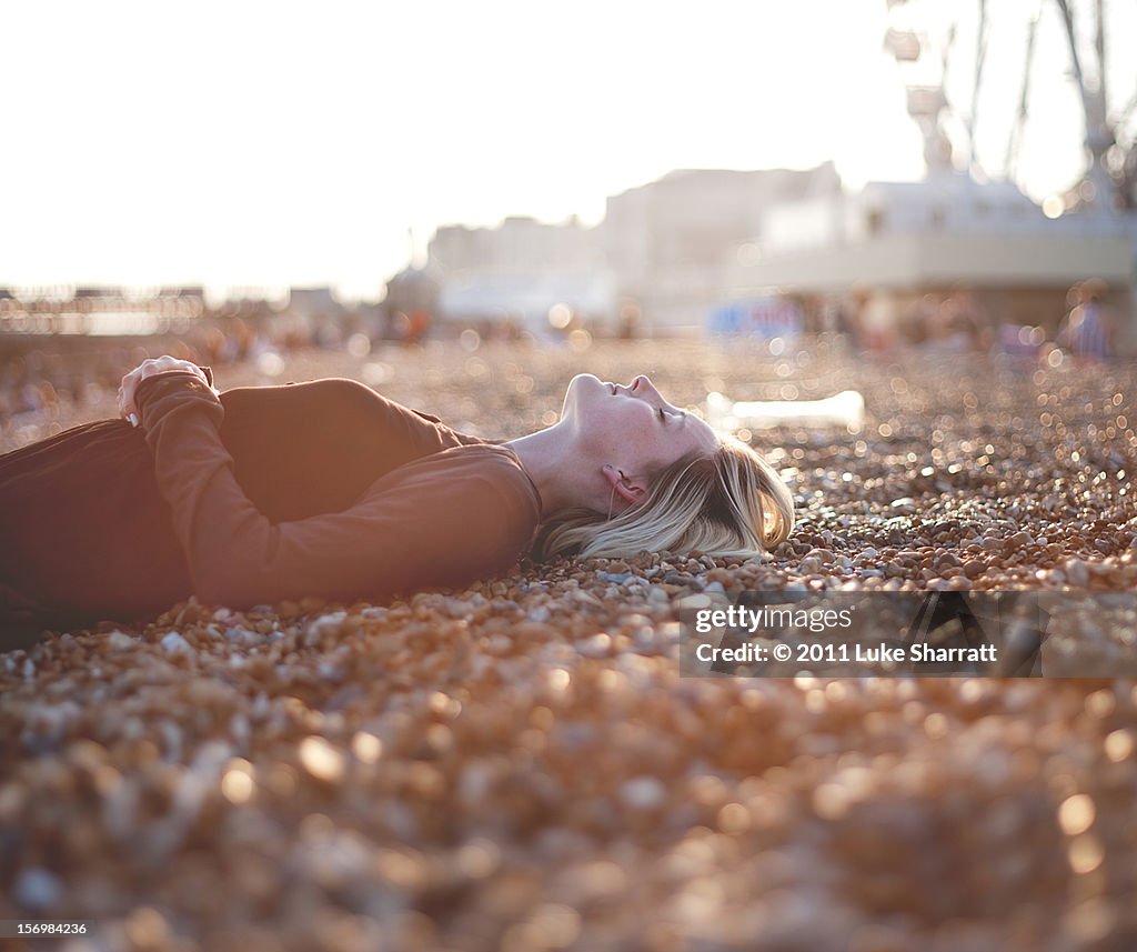 Portrait of girl lying on beach