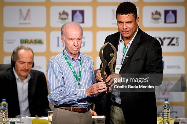 Famous Brazilian former football star Ronaldo Nazario , poses with ex football player and coach Mario Jorge Lobo Zagallo after receiving from him a...