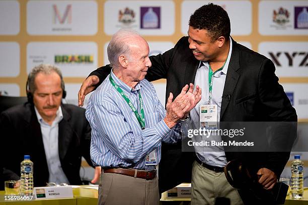 Famous Brazilian former football star Ronaldo Nazario , poses with ex football player and coach Mario Jorge Lobo Zagallo after receiving from him a...