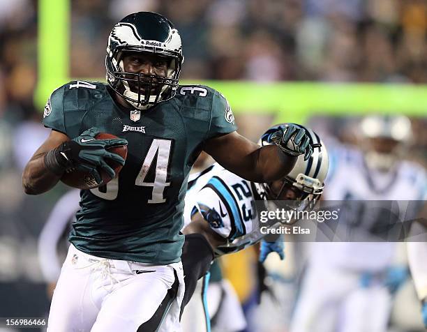 Bryce Brown of the Philadelphia Eagles carries the ball in for a touchdown as Sherrod Martin of the Carolina Panthers defends on November 26, 2012 at...