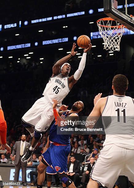 Gerald Wallace of the Brooklyn Nets goes up in overtime but misses the basket against the New York Knicks at the Barclays Center on November 26, 2012...