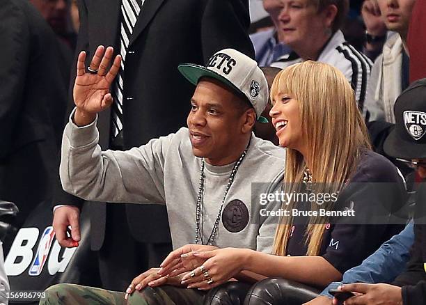 Jay Z and Beyonce attend the game between the Brooklyn Nets and the New York Knicks at the Barclays Center on November 26, 2012 in the Brooklyn...