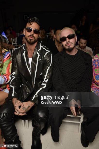 Michele Morrone and J Balvin in front row at Moschino RTW Spring/Summer 2023 on September 22, 2022 in Milan, Italy.
