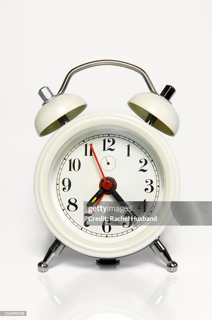 Alarm clock with partial reflection