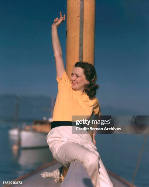 Janet Gaynor vivid color 1940's portrait on yacht.