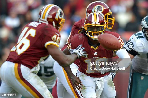 Robert Griffin III of the Washington Redskins pitches the ball during the game against the Philadelphia Eagles at FedEx Field on November 18, 2012 in...