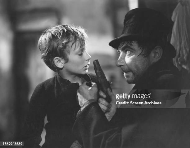 Film version with Robert Newton as Bill Sikes and John Howard Davies in the title role from the David Lean directed classic 'Oliver Twist'.