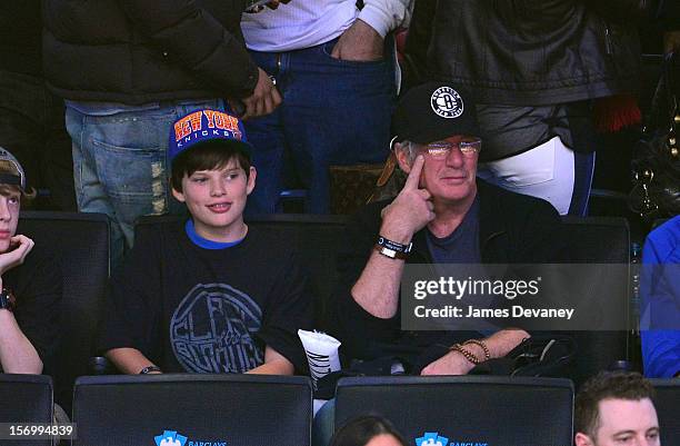 Richard Gere and son Homer James attend the New York Knicks vs Brooklyn Nets game at Barclays Center on November 26, 2012 in the Brooklyn borough of...