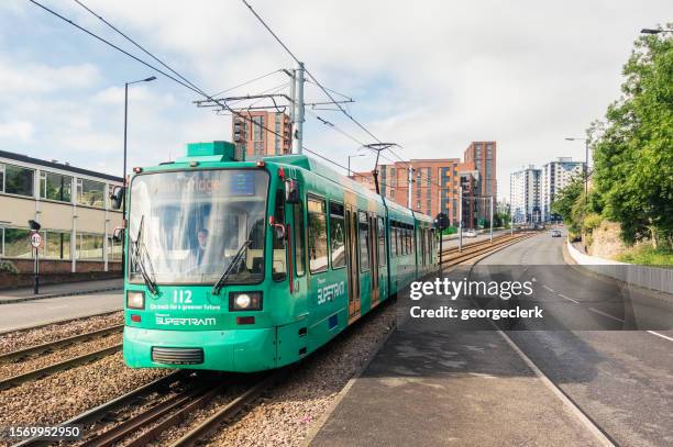 tram on the move in sheffield - sheffield supertram stock pictures, royalty-free photos & images