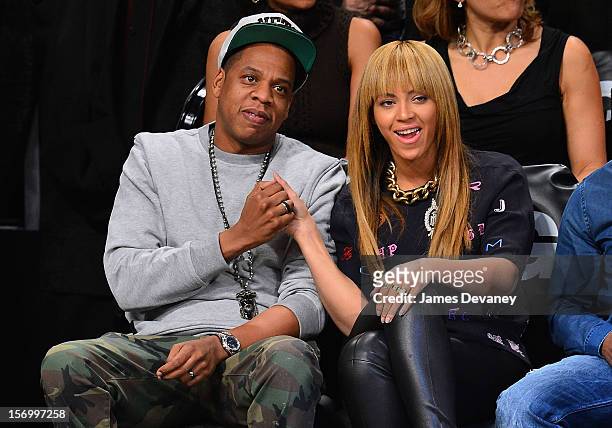 Jay-Z and Beyonce Knowles attend the New York Knicks v Brooklyn Nets game at Barclays Center on November 26, 2012 in the Brooklyn borough of New York...