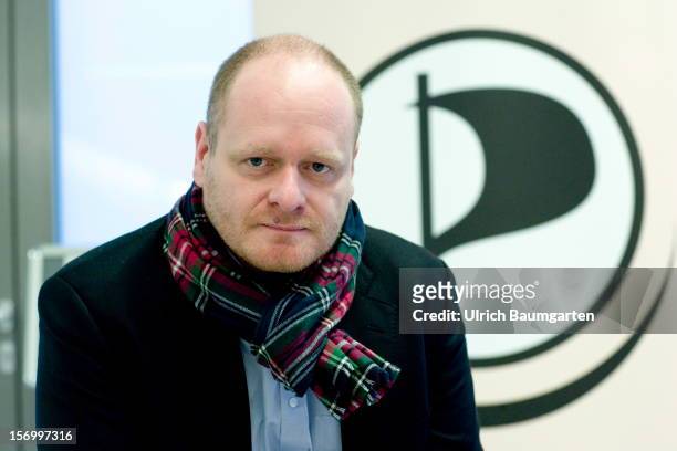 Bernd Schloemer, federal chairman of the Pirate party, in front of the party logo at the Pirate Party National Convention at RuhrCongress on November...