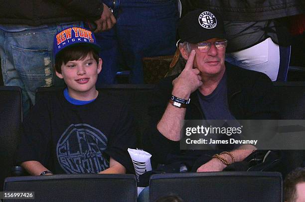 Richard Gere and son Homer attend the New York Knicks v Brooklyn Nets game at Barclays Center on November 26, 2012 in the Brooklyn borough of New...
